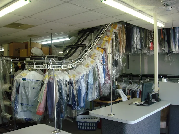 Freshly cleaned clothing neatly hung in Corinium Cleaners